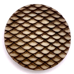 Glass button with sepia of imitation snake skin.