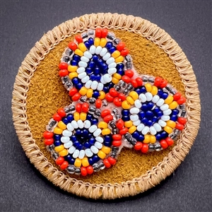 Native American beaded leather button.