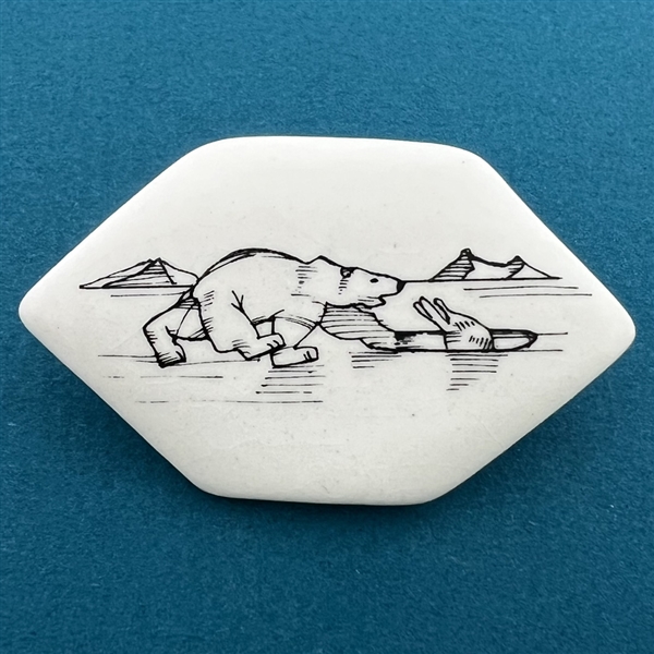 Ceramic studio button of polar bear chasing a seal by Stella Rzanski.