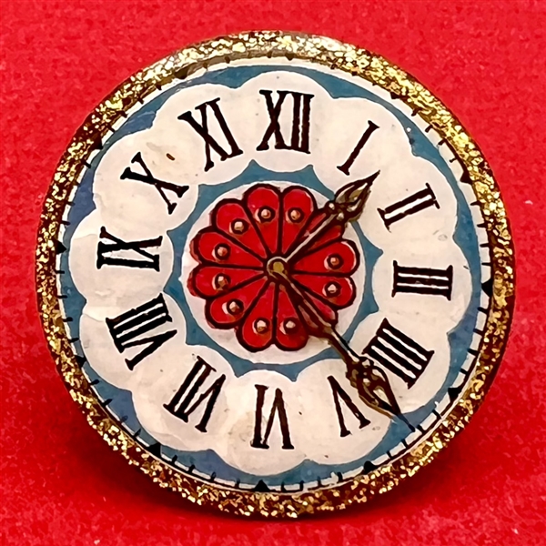 Nancy DuBois watch crystal studio button of a clock face.