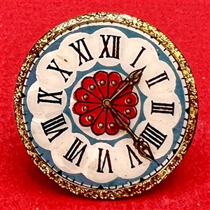 Nancy DuBois watch crystal studio button of a clock face.