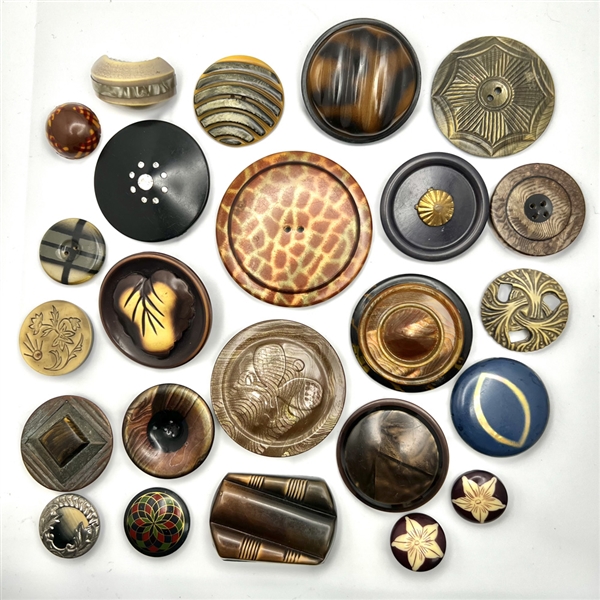 Twenty four Vintage celluloid and other plastic buttons.