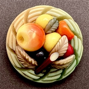 Vintage celluloid button of a basket of fruit by Marion Weeber