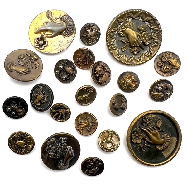 Twenty one assorted brass buttons of hands holding flowers.