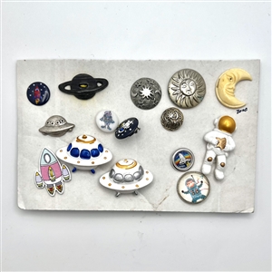 Card of fifteen assorted “space” themed buttons.