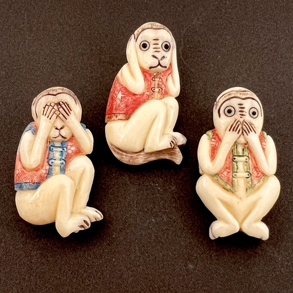 Set of three carved natural material buttons of “see, hear and speak no evil.”