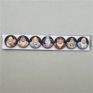 Set of seven Gods of Fortune Arita buttons.