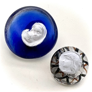 Two paperweight glass buttons with sulfides.