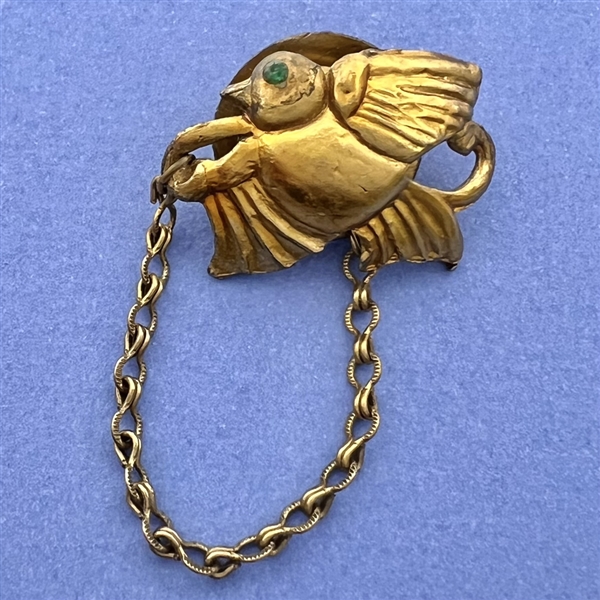 Vintage snapette of metal bird.