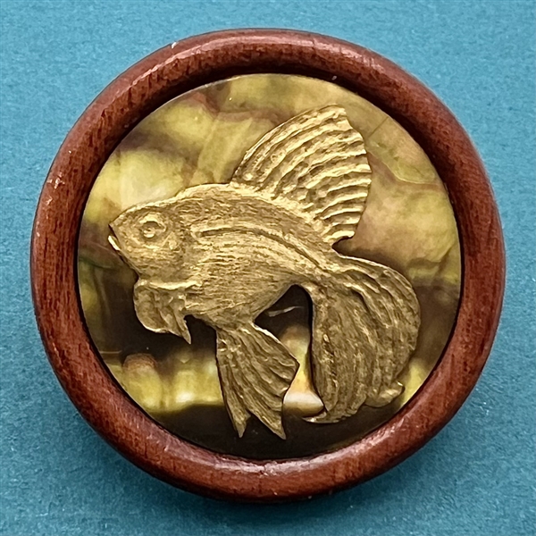 Studio button of a fish by Herman Bangman (?)