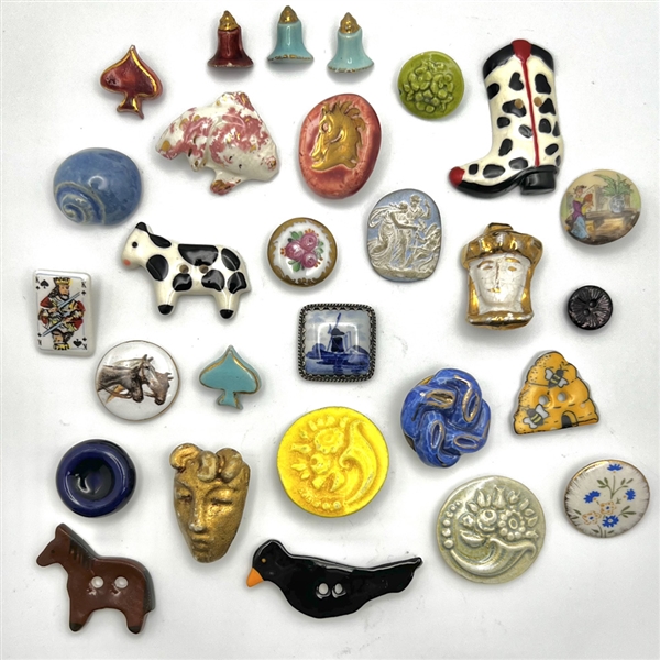 Twenty eight ceramic buttons.