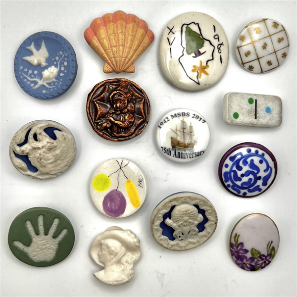 Fourteen ceramic buttons.