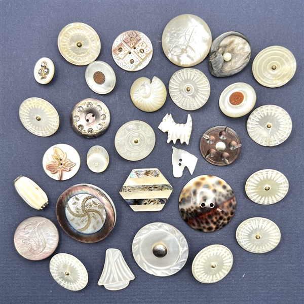 Thirty pearl and shell buttons.