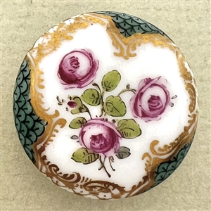 An 18th c. porcelain button of roses and unusual border.