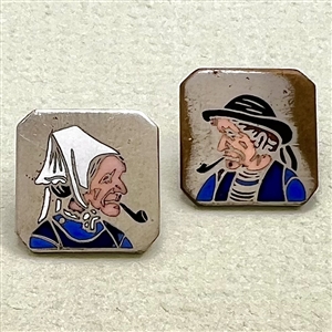 Two 20th c. French silver buttons with enamel of a country couple smoking pipes.