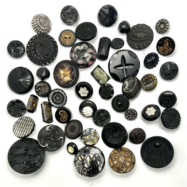 Forty nine black glass buttons.