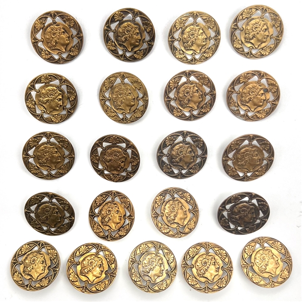 Set of twenty one brass buttons with openwork.