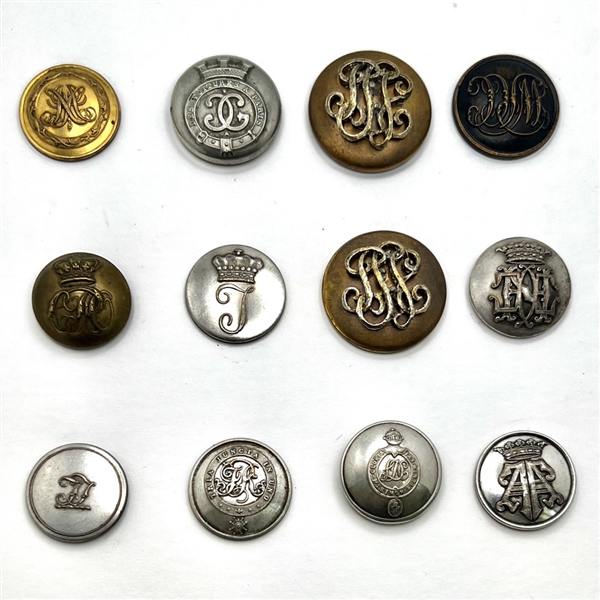 Twelve Livery buttons of monograms and initials.