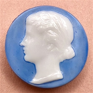 Div. I. glass button of a woman in profile.