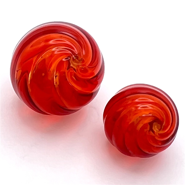 Mother/daughter blown glass modified ball buttons.