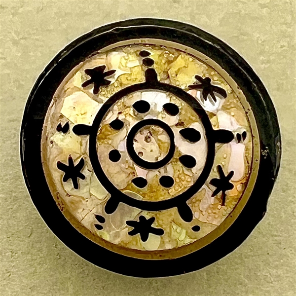 Div. l.  watch crystal button of target and stars design.