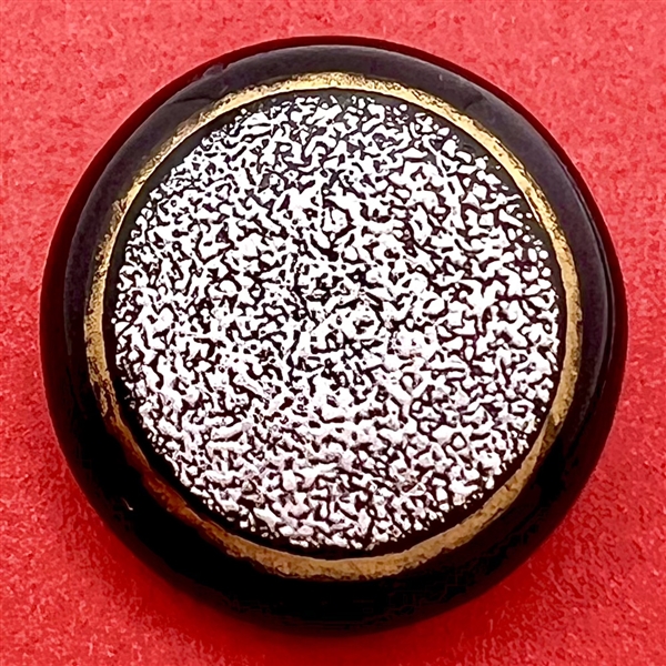 Salt encrusted overlay black glass button.