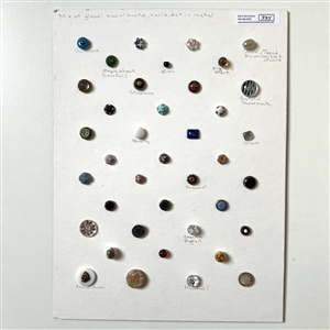 Card of 39 small and diminutive size assorted glass buttons.