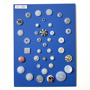 Card of 34 assorted clam broth glass buttons.