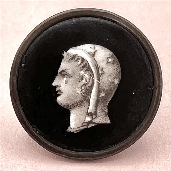 A 19th c. Liverpool transfer button of woman wearing a scarf of stars.