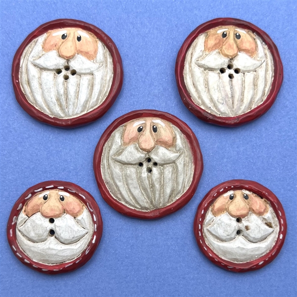 Five wood Santa Claus buttons. 