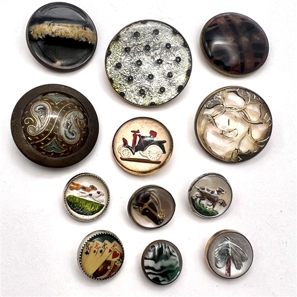 Group of 12 glass in metal buttons.