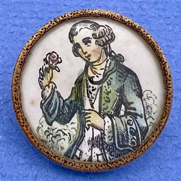 A 19th c. Painting on paper under glass button of a French man.