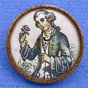 A 19th c. Painting on paper under glass button of a French man.