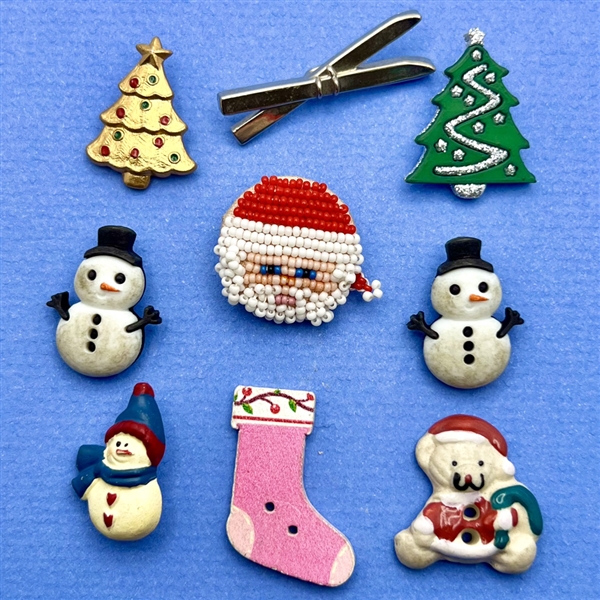 Nine assorted Christmas and winter themed buttons.