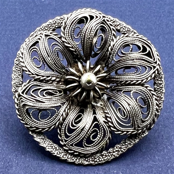 Large silver filigree button.