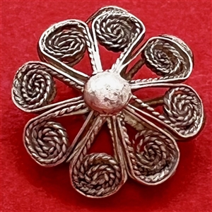 Small silver filigree button.