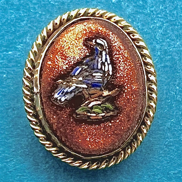 Italian micro mosaic oval button of a blue bird in goldstone.