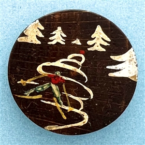 Vintage French couture button of a skier by Louise Richard.