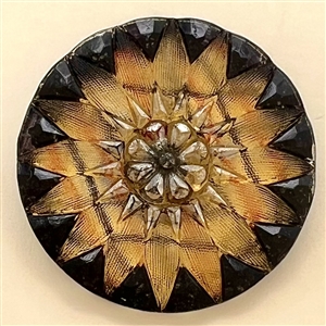 Lacy glass button in a tartan pattern flower.