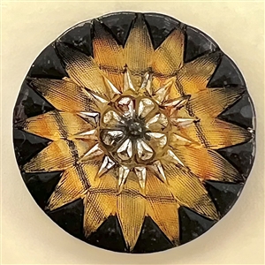 Lacy glass button in a tartan pattern flower.