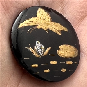 Div. I black glass with luster combination button of butterfly over lily pads