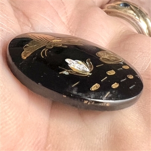 Div. I black glass with luster combination button of butterfly over lily pads