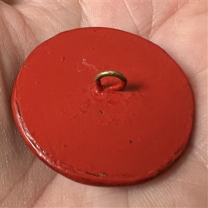 Chinese cinnabar button of an Asian man and boy.