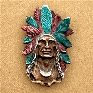 Battersea pewter button of a Native American chief in a headdress. 