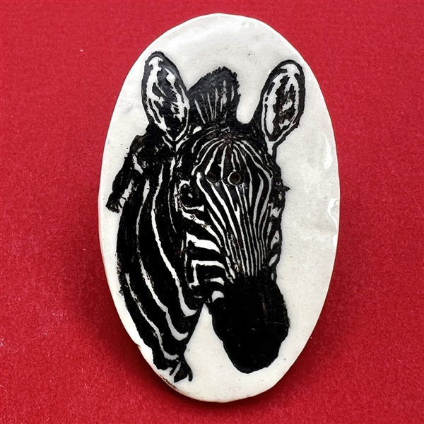 Ceramic studio button of a zebra by Diana M.B.