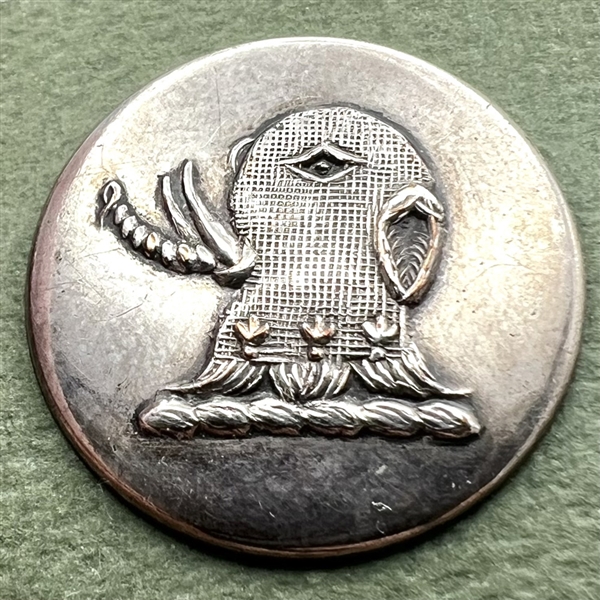 Livery crest button of an elephant in armor.