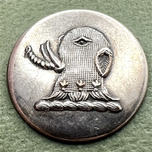 Livery crest button of an elephant in armor.