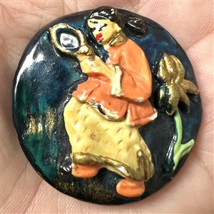 VIntage plaster button of Asian woman with mirror.