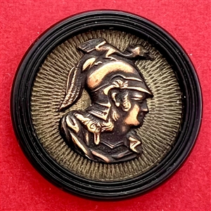 Brass button of Minerva over composition (?).