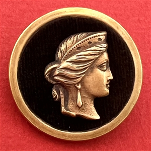 Thread back Victorian velvet button with woman’s profile.